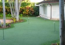 Southwest Greens backyard putting area with synthetic grass lawn and landscape 1